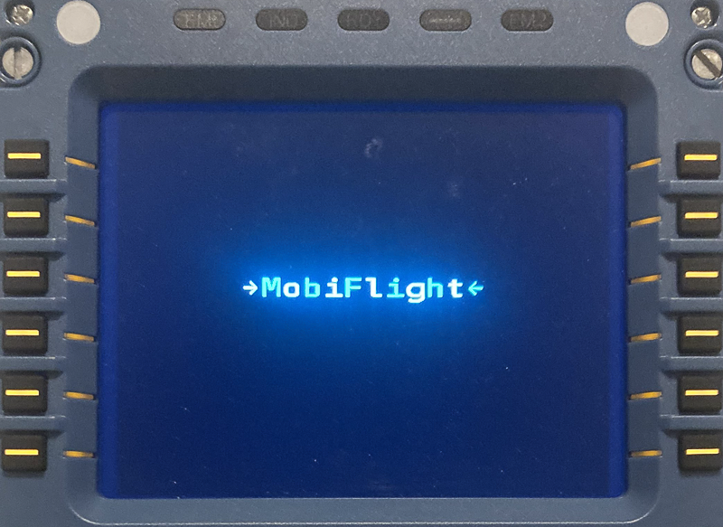 Photo of a WINWING CDU with -->MobiFlight<-- showing on the display.
